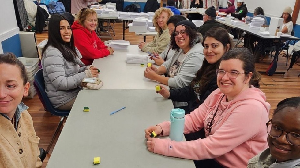 A group of volunteer students and staff at a shelter.
